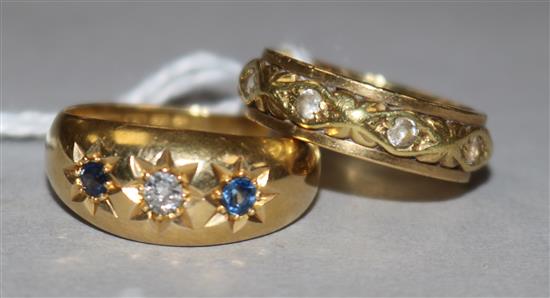 An 18ct gold, sapphire and diamond gypsy-set ring and a yellow metal (14ct) eternity ring.